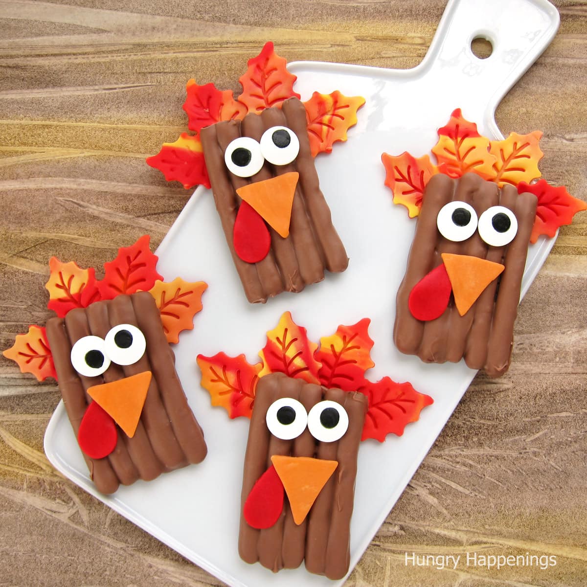 Chocolate-dipped turkey pretzels with colorful modeling chocolate features.