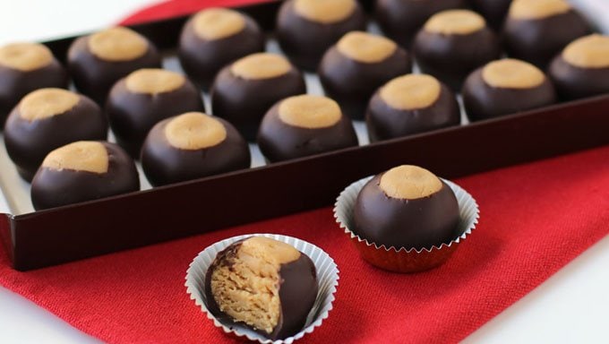 Turn peanut butter cake into Cake Ball Buckeyes to add a fun twist to your holiday candy plates. 