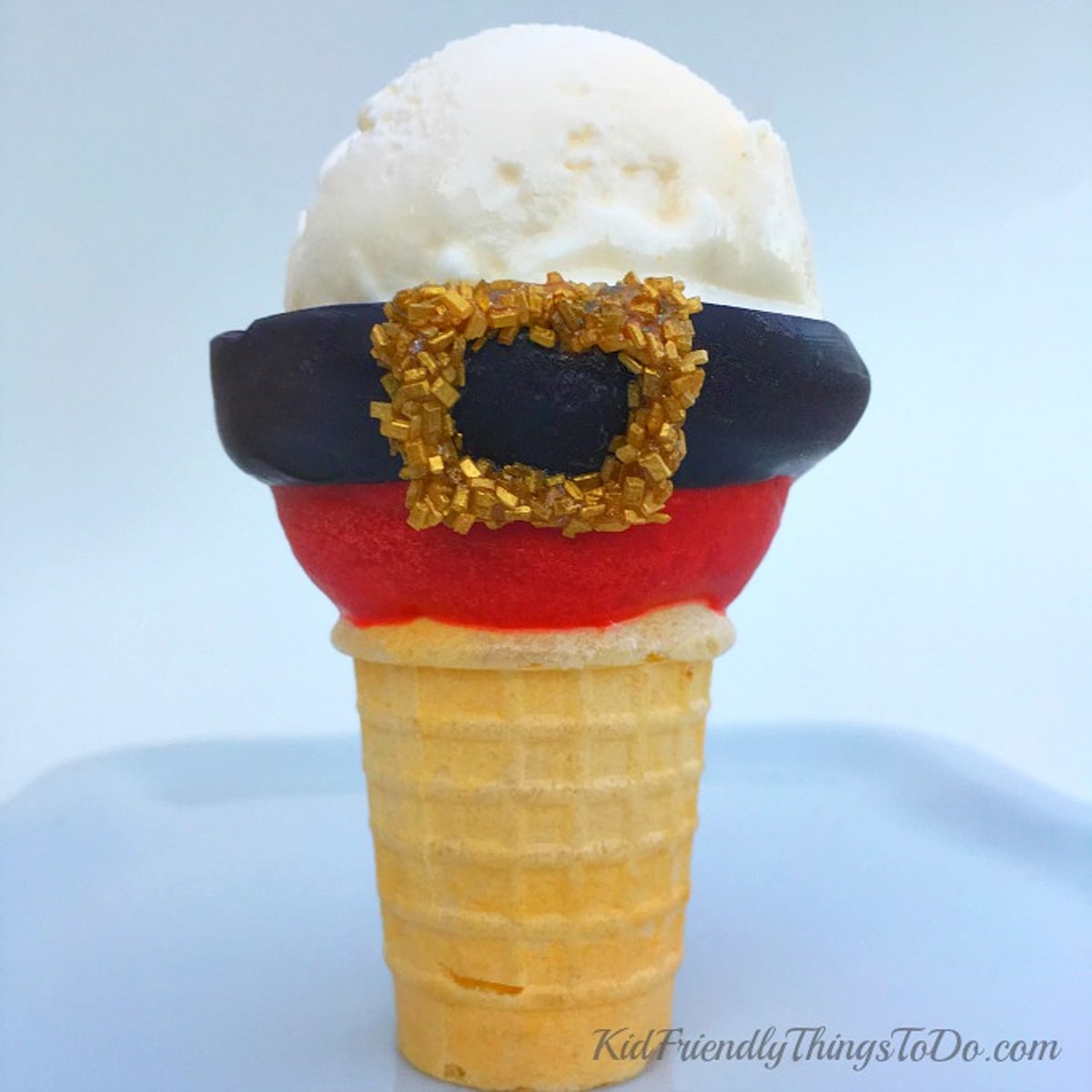 chocolate-dipped ice cream cone Santa suit filled with a scoop of vanilla ice cream