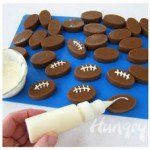 Turn oval shaped caramels into footballs by piping on white chocolate laces.