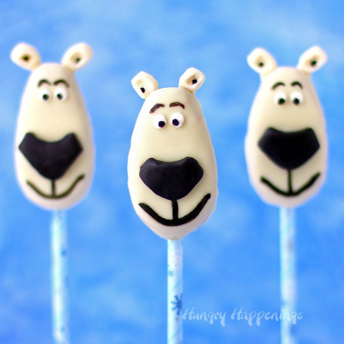 Transform a store bought white chocolate peanut butter fudge filled egg into Norm of the North Lollipops using either modeling chocolate or chewy chocolate and vanilla candies. See how at HungryHappenings.com.