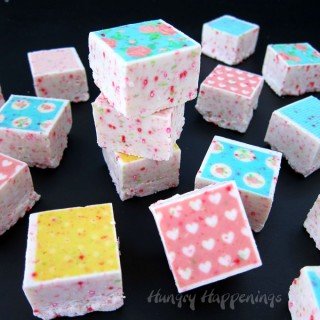 Add colorful designs to white chocolate fudge by using Sugar Stamps. It is so easy to turn ordinary fudge into an exciting treat for Valentine's Day or any day. See how at HungryHappenings.com