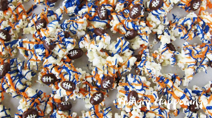 Make white chocolate popcorn with your favorite team colors to cheer on your team for Super Bowl. See the tutorial at HungryHappenings.com.
