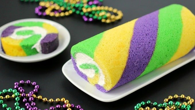 Break tradition and celebrate Mardi Gras by making this festive green, gold, and purple King Cake Roll.