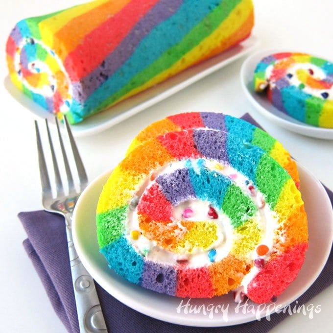 Brightly colored Rainbow Cake Roll filled with Rainbow Chip Frosting makes a festive dessert for St. Patrick's Day, Easter, or a birthday.