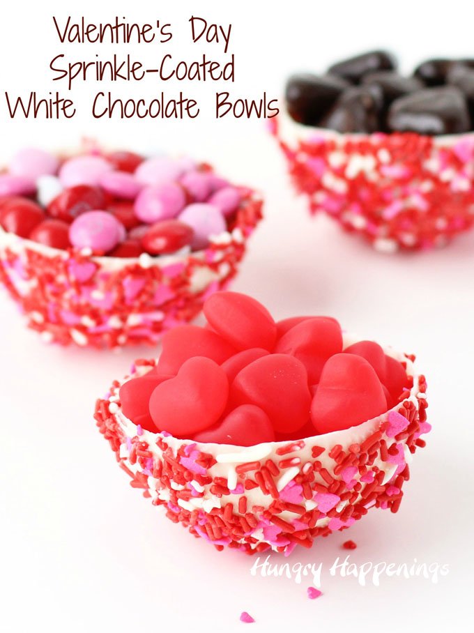 Sprinkle-Coated White Chocolate Bowls made using a mold, not a balloon, can be filled with your favorite ice cream, mousse, pudding, or candy for Valentine's Day. See how easy they are to make at HungryHappenings.com.