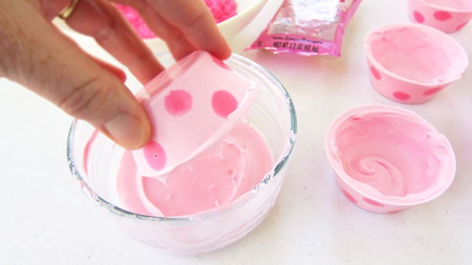 How to add a rim of rock candy to pink polka dot candy cups.