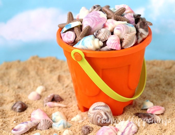 Swirled chocolate seashells in a plastic beach pail. 