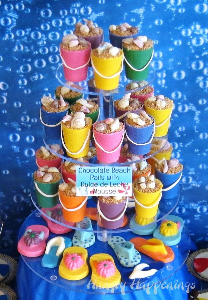 Colorful Mini Chocolate Beach Pails filled with Dulce de Leche Mouse, Toffee Bits and Chocolate Shells. 