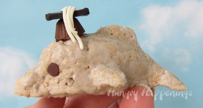 Make mini graduation caps using tiny peanut butter cups and modeling chocolate then add them to Dolphin Rice Krispie Treats. 
