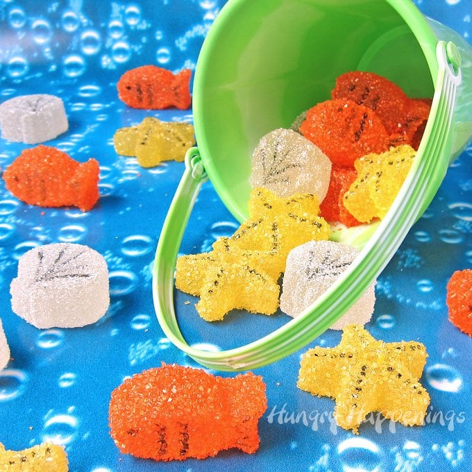 Under the Sea Gumdrops: gumdrop fish, starfish, and seashells spilling out of a green beach pail onto bubble paper. 