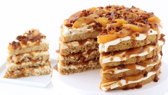 If you love cake and peach cobbler, you are going to go nuts over this dessert mashup. This Peach Cobbler Layer Cake combines a lightly spiced cinnamon cake with layers of cream cheese fluff, caramelized peaches, and a crispy brown sugar cake crumble. 