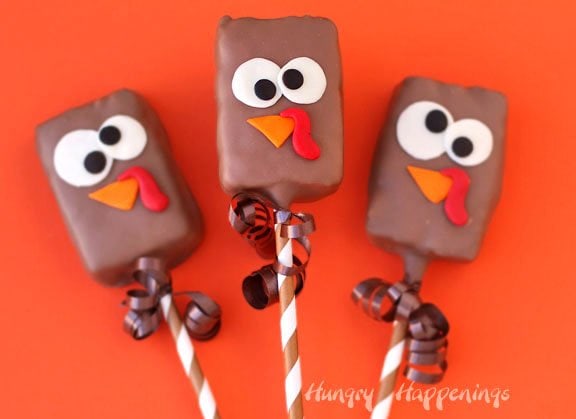Chocolate dipped Rice Krispie Treat Turkeys decorated with candy clay are perfect treats for Thanksgiving.