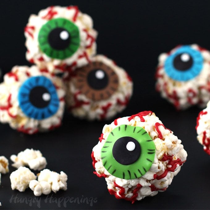 Make a quick batch of popcorn balls using the microwave then dress them up to look like gruesome Popcorn EYEballs for Halloween using candy clay.