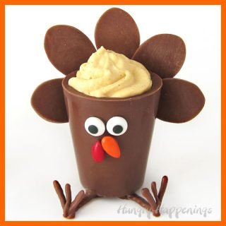 milk chocolate turkey candy cup filled with pumpkin mousse