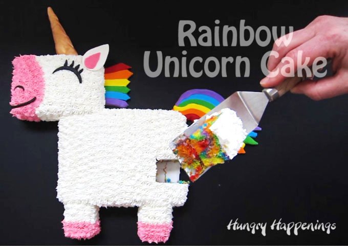 Cut into this adorable Rainbow Unicorn Cake to find swirls of rainbow colored cake.