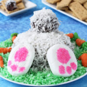 chocolate cheese ball bunny butt covered in coconut with marshmallow feet.