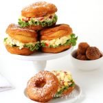 You'll never serve egg salad on white bread again once you try this Donut BLT Egg Salad Strangewich. This unusual sandwich is even better than it looks, and it looks pretty amazing!