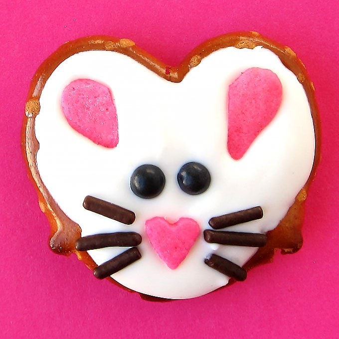 These salty and sweet Easter Bunny Pretzel Twists are so darn cute and easy to make using heart shapes sprinkles, chocolate jimmies, and black candy pearls. These cute treats are perfect basket fillers!