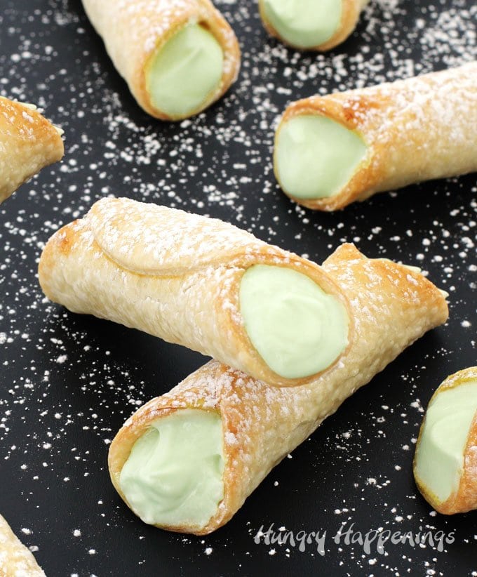 Give a classic summer recipe a fun twist. These sweet and tart Key Lime Pie Cannoli are simple to make using just 4 ingredients and don't need to be cut into slices when serving so they are perfect for an outdoor party, a pot-luck, or even a bridal shower.