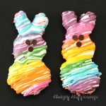 This Easter brighten up your Easter baskets by adding some Rainbow Peeps Cereal Treats. Each bunny shaped Fruity Pebbles Marshmallow Treat is drizzled with a rainbow of colorful Candy Melts to match the stuffed Rainbow Peeps.