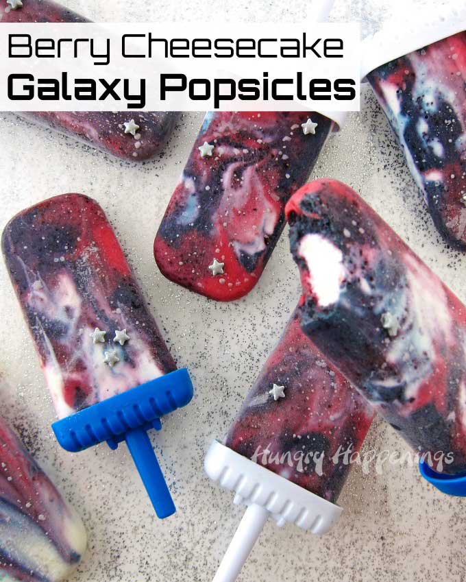 Berry Cheesecake Galaxy Popsicles are made with blueberries, raspberries, and luscious cheesecake! They are out of this world. 