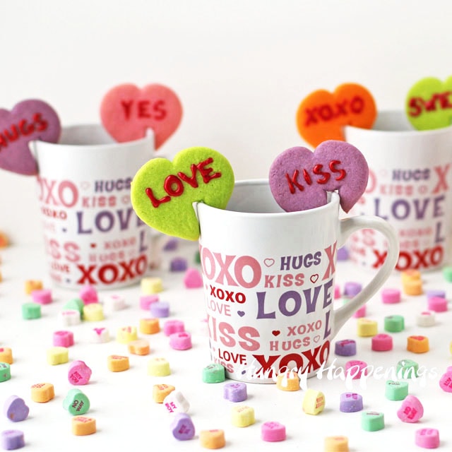 conversation heart cookies with notches cut out so they sit on coffee mugs