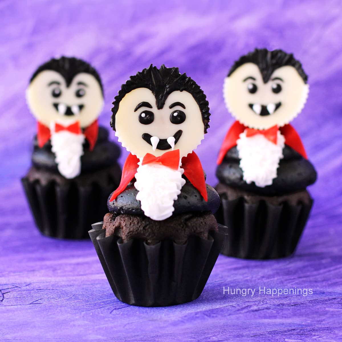 vampire cupcakes decorated with white Reese's Cup vampires.