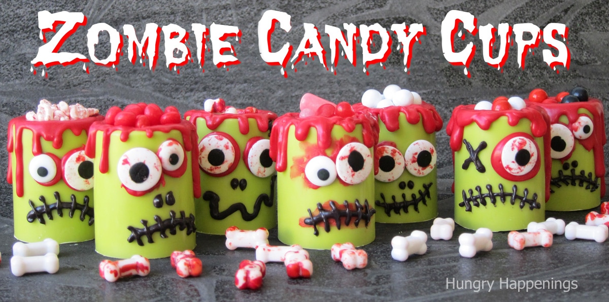 zombie candy cups filled with Halloween candy.