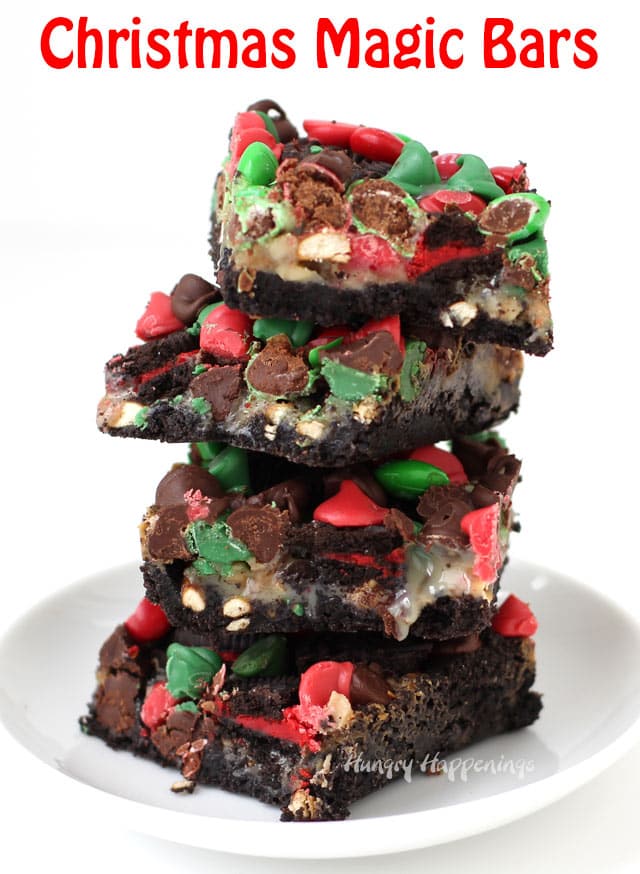 Christmas Magic Bars piled on top of each other on a white plate and white background with text 