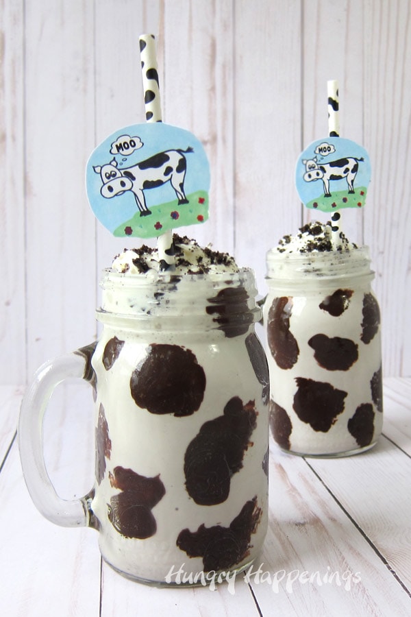 MOO Shakes - Cookies & Cream Milkshakes served in mason jars decorated with chocolate ganache spots are served with fun cow spot paper straws. 