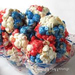 Red, white, and blue popcorn balls make fun desserts for a 4th of July party.