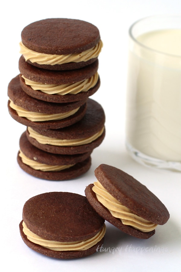 Chocolate Peanut Butter Sandwich Cookies served with a glass of milk.
