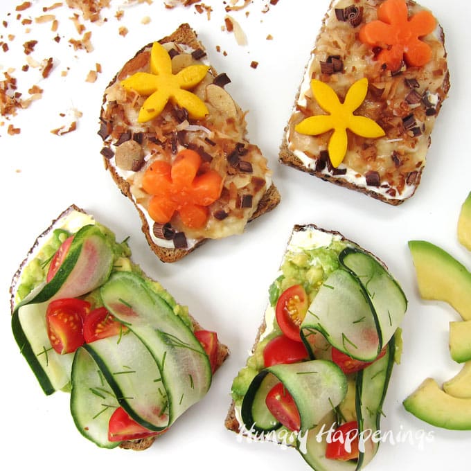 Avocado toast with cucumbers, tomatoes, and dill accompanied by Tropical Toast topped with bananas, toasted coconut, chocolate, almonds, mango and papaya flowers. 