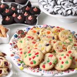 gumdrop cookies on a Christmas cookie platter surrounded by chocolate kiss cookies, crinkle cookies, and more