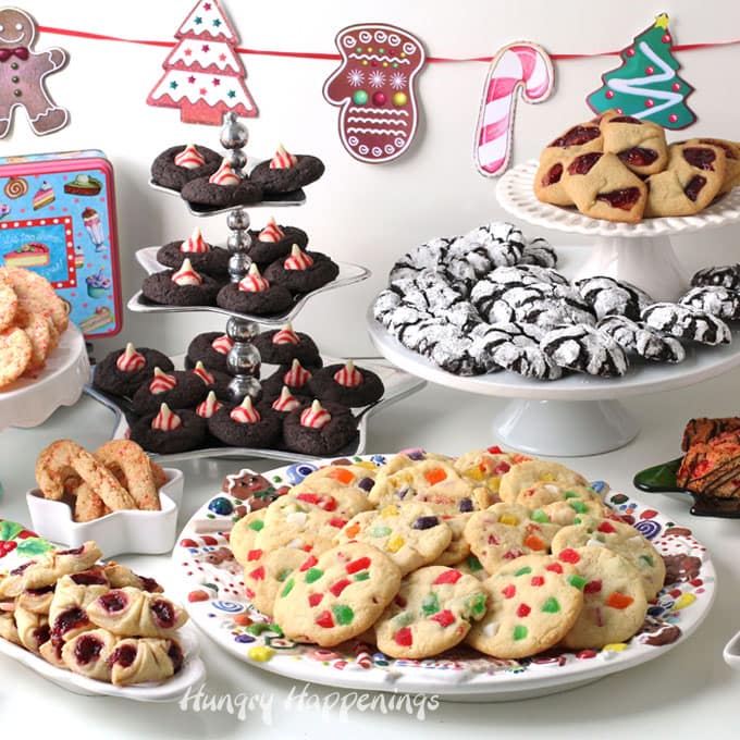 Display of cookies arranged on platters and cake stands for a Christmas Cookie Exchange.