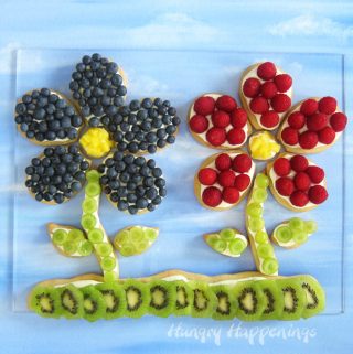 Fruit shaped fruit pizzas are made with a crispy sugar cookie, cheesecake filling, and fresh fruit.