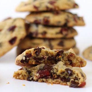 Chocolate chip cookies loaded with orange juice soaked dried cranberries and orange zest are soft and chewy and oh, so good!