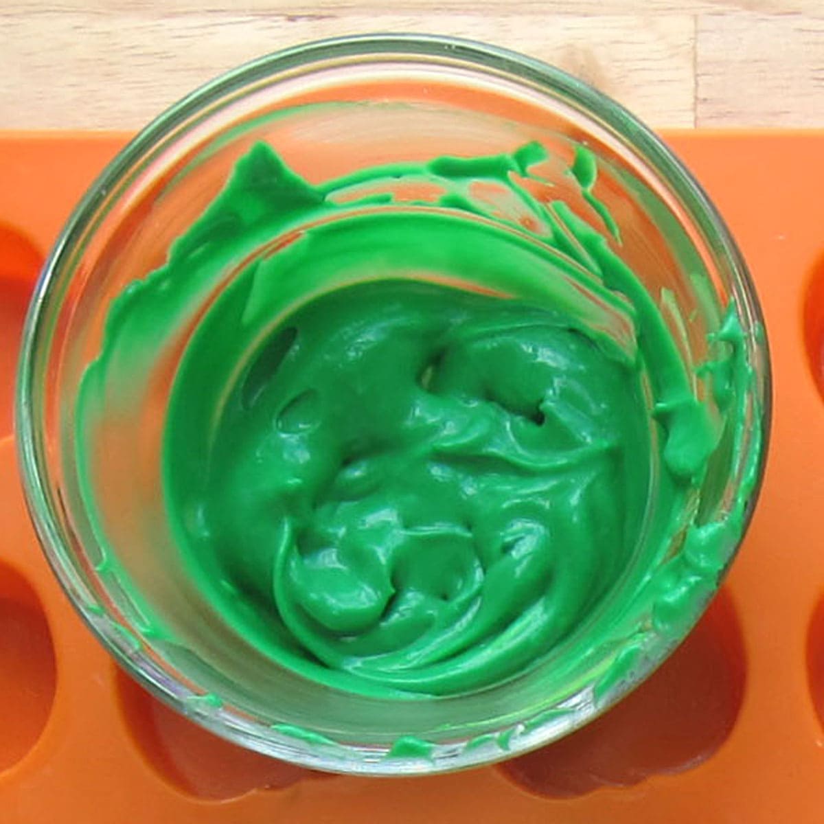 a bowl of green-colored cheesecake filling.