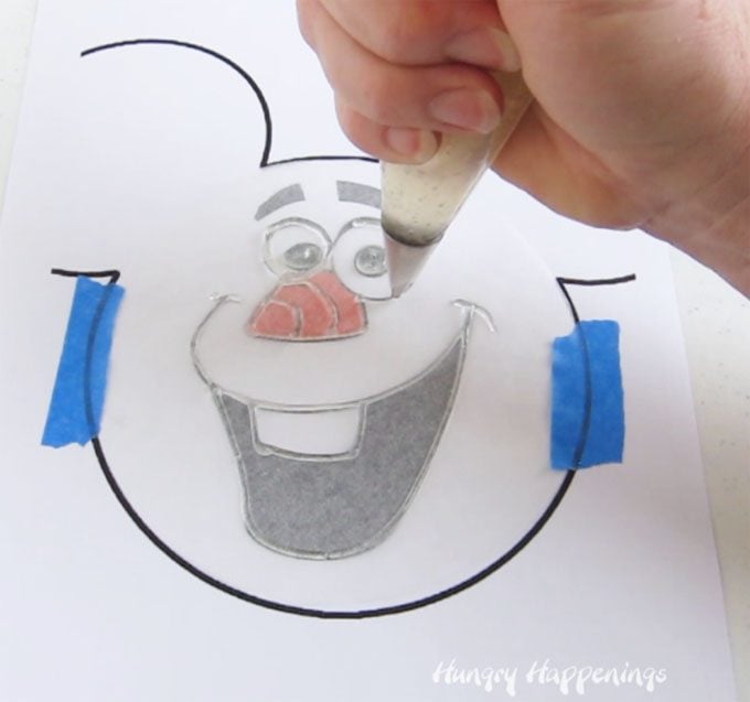 Learn how to make a clear piping gel transfer to make an Olaf Cake.