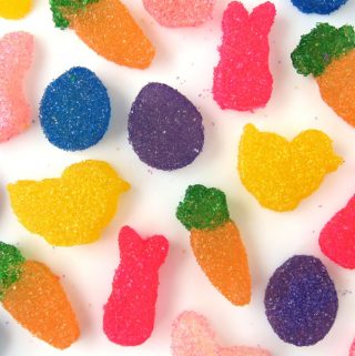brightly colored homemade sour easter gumdrops in bunny, carrot, chick, and egg shapes