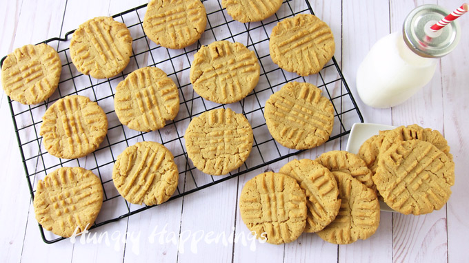 homemade peanut butter cookies on a cooling rack with a bottle of milk
