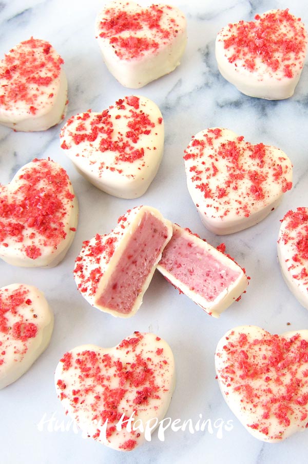 heart-shaped strawberries and cream truffle hearts dipped in white chocolate and sprinkled with freeze dried strawberries