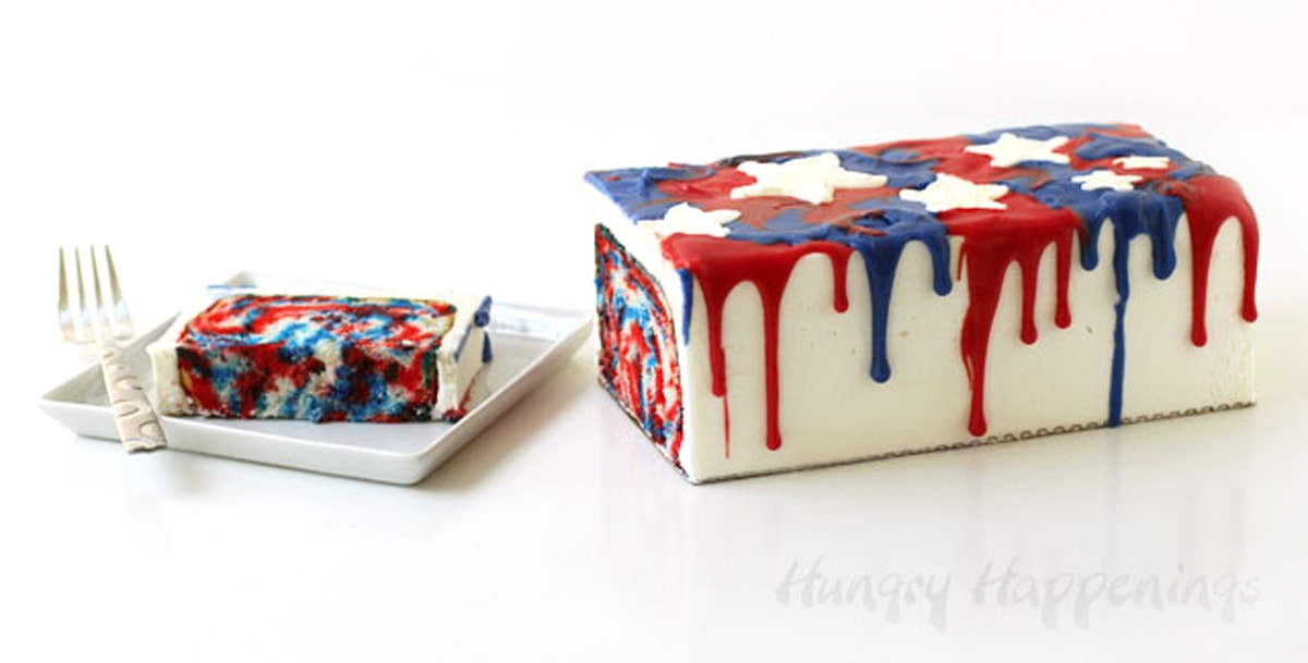 4th of July cake with a red, white, and blue swirled cake topped with white frosting and red and blue drips.