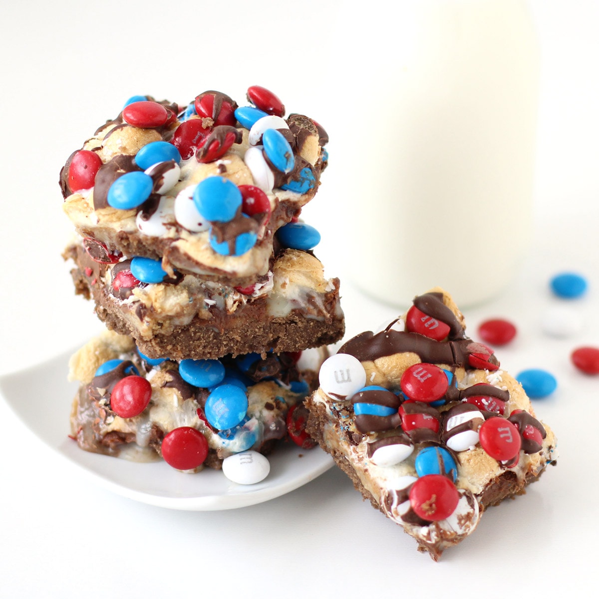 4th of July Magic Cookie Bars topped with red, white, and blue M&M's .
