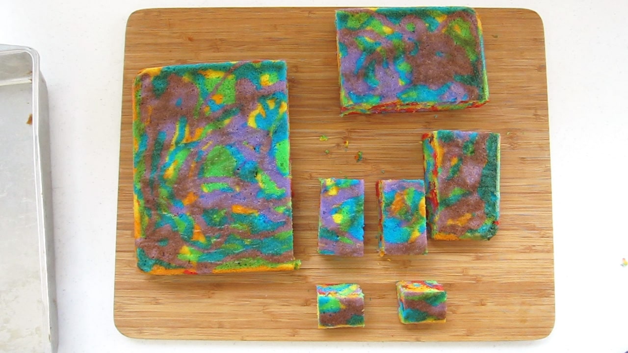 rainbow cake cut into the pieces used to assemble the unicorn cake. 