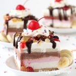banana split ice cream bars with layers of vanilla, strawberry, and chocolate ice cream and chocolate, pineapple, and strawberry toppings
