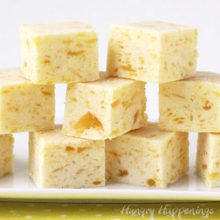 Pineapple Fudge with specks of pineapple in creamy fudge squares.