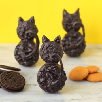 chocolate black cat cookies made from OREO Cookies and Vanilla wafers.
