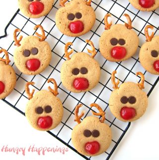 peanut butter reindeer cookies with maraschino cherry noses, pretzel antlers, and chocolate chip eyes.